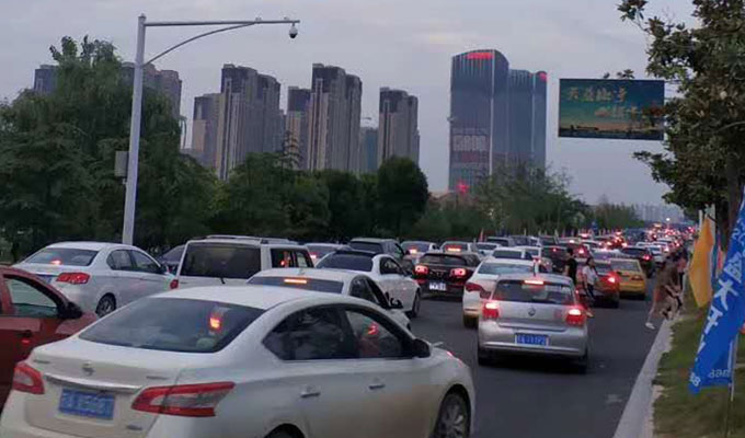 Cars choke the main approach to the latest Wanda Mall in China