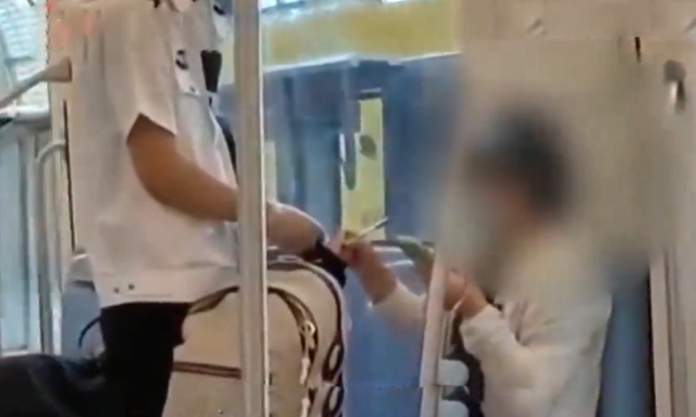 The Nanjinger - Fined on Metro for Watching Movie (but won't Put Her Phone Down)