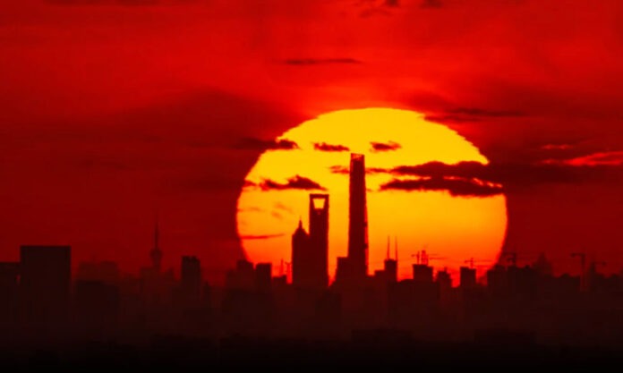 The Nanjinger - Time Lapse Filmed from Suzhou Shows Sun Rise behind Shanghai Tower