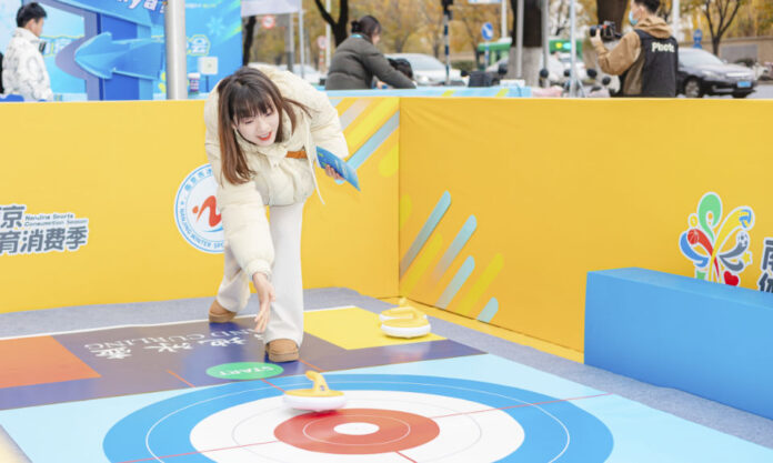 The Nanjinger - Nanjingers Try out Curling in Golden Eagle’s Pup up Ice Rink